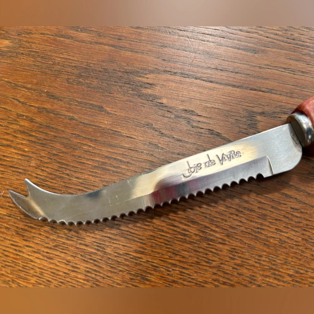 Joie de Vivre hooked blade cheese knife w carved leaf handle. Perfect addition !